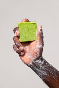 african-person-washing-hands-with-soap-isolated-white_23-2149010794